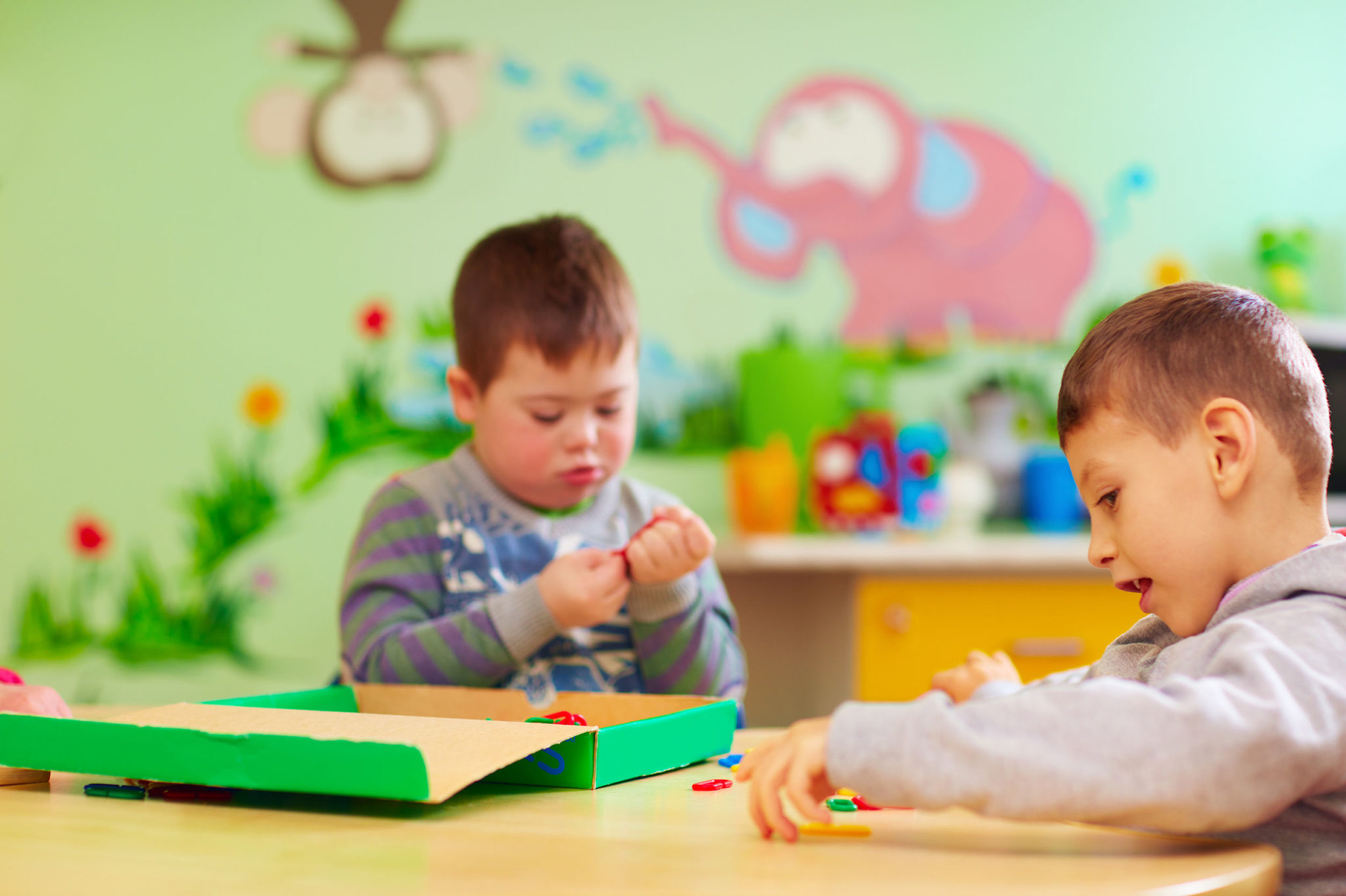 kids with special needs develop their fine motility skills in daycare rehabilitation center